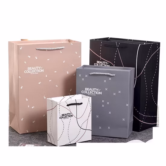 Sacchetto di carta di cartone rosa di lusso con logo personalizzato campione gratuito con manico a nastro